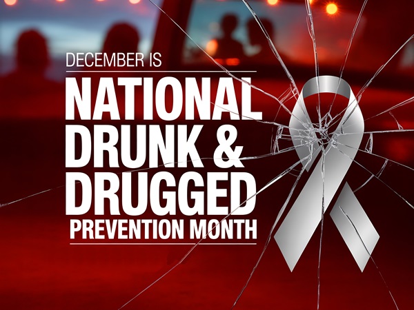 A graphic for National Drunk & Drugged Driving Prevention Month featuring a silver awareness ribbon and text over a background of cracked glass.